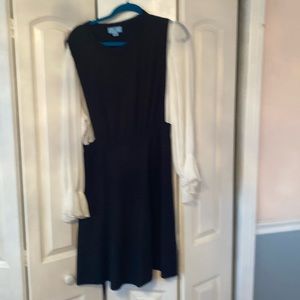 Black knit dress with flowing sleeves